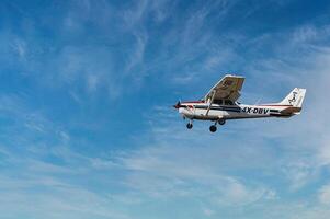 Herzliya, Israel. May 1, 2023. CESSNA 172M SKYHAWK with cloud sky landing configuration, copy space. photo