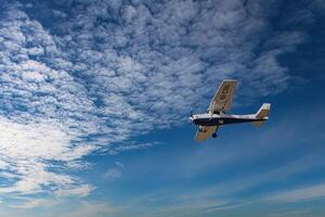 Herzliya, Israel. May 1, 2023. CESSNA 172M SKYHAWK with cloud sky landing configuration, copy space. photo