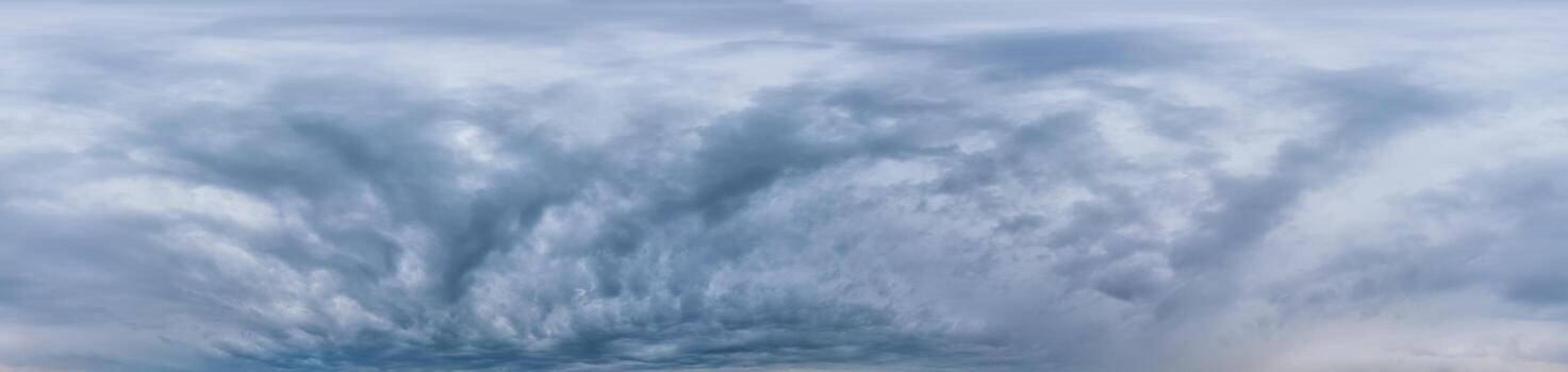 Sky panorama on overcast rainy day with low clouds in seamless spherical equirectangular format. Complete zenith for use in 3D graphics, game and for aerial drone 360 degree panorama as a sky dome photo