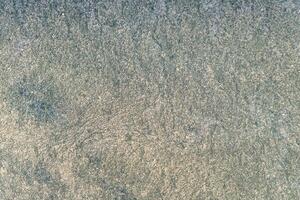 Selective focus. First frost on a frozen car, late autumn close-up. Beautiful abstract frozen microcosmos pattern. Freezing weather frost action in nature. Winter backdrop. photo