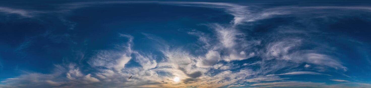 Sunset sky panorama with Cirrus clouds in Seamless spherical equirectangular format. Complete zenith for use in 3D graphics, game and for composites in aerial drone 360 degree panoramas as a sky dome photo
