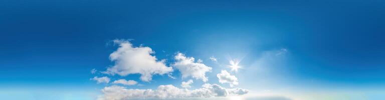 Seamless panorama of sky with light clouds in spherical equirectangular format with complete zenith for use in 3D graphics, game and for composites in aerial drone 360 degree panoramas as a sky dome. photo