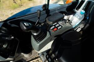 Controls of a small excavator in the cab. Background for special equipment theme concept photo