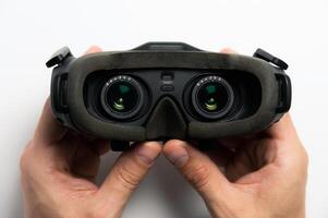 Black fpv or virtual reality glasses with lenses, on a white background. Close-up view from inside photo
