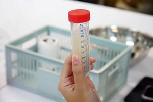 Asian students conduct a science experiment on extracting DNA from onions serves as a blueprint for everything in living cells, serving to tell the organism what it should look like and how it works. photo