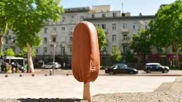 close up slow motion ice cream melts in very hot summer day in direct sunlight. Concept heat wave summer holidays extreme temperatures and global warming affects video