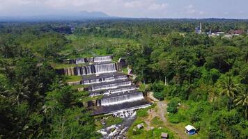 Aerial footage of the Watu Purbo Sabo Dam in Sleman, Indonesia which has a 6-level water dam. Apart from preventing the eruption of Mount Merapi, this dam is also a popular tourist destination photo