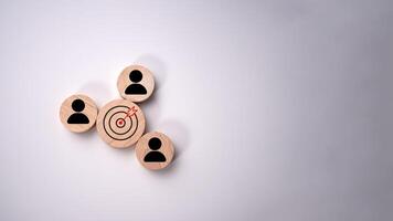 Dartboard and red arrow connection linkage with human icon for customer focus target group and customer relation management concept, Target customer, Marketing plan and strategies. photo