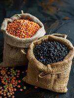 An assortment of colorful beans displayed in rustic burlap sacks photo