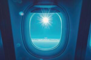 Sunlit airplane window view of sky and clouds scene. photo