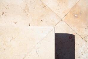 closeup top view of marble stairs with harsh shadow, geometric abstract photo