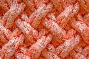 Color the year 2024 Peach Fuzz fabric texture. photo