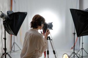 Happy Woman Holding Camera Taking Photo Indoors.