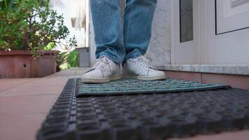 A Man's Shoes Wiping At The Doorstep Of The House On A Doormat video