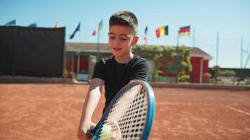 Child Learns To Grip The Tennis Racket With The Ball video