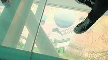 A view of the city of Dubai from a glass observation bridge with tourists. video