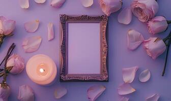White blank card in a bronze frame on a pastel lavender table, with a scattering of petals and a lit candle photo