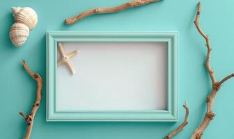 White blank card in a turquoise frame on a pastel turquoise background, with a seashell and a piece of driftwood photo