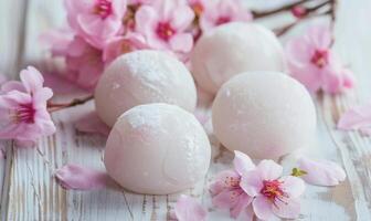 Japanese sakura mochi on a light wooden background photo