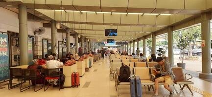 View of the Pasar Senen train station area. Local train and passengers activity. Jakarta, Indonesia - June 8, 2024 photo