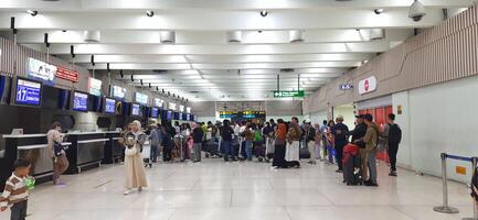 View of passengers activity and interior at terminal 1A Soekarno-Hatta International airport Jakarta, Indonesia - June 11 2024 photo