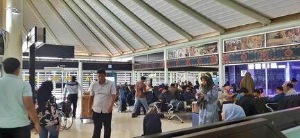View of passengers activity and interior at terminal 1A Soekarno-Hatta International airport Jakarta, Indonesia - June 11 2024 photo