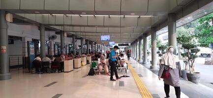 Atmosphere at railway train station. Local train activity in Indonesia. Railway road. Jakarta, Indonesia - Mei 28 2024 photo