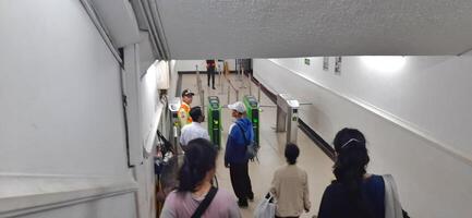 Atmosphere at railway train station. Local train activity in Indonesia. Railway road. Jakarta, Indonesia - Mei 28 2024 photo