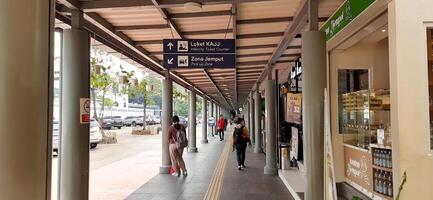 Atmosphere at railway train station. Local train activity in Indonesia. Railway road. Jakarta, Indonesia - Mei 28 2024 photo