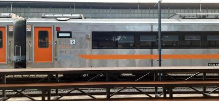 Atmosphere at railway train station. Local train activity in Indonesia. Railway road. Jakarta, Indonesia - Mei 28 2024 photo