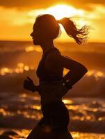 a woman running on the beach at sunset photo