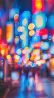blurred image of a busy city street at night photo