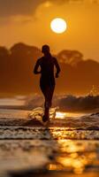 a woman running on the beach at sunset photo
