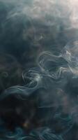 smoke rising from the water in a dark background photo