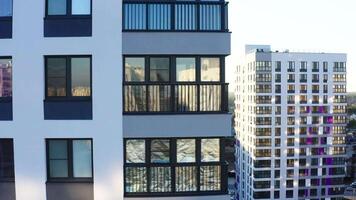 Top view of residential windows of modern house. Stock footage. Beautiful reflection of windows of modern residential building. Modern architecture design of residential building video