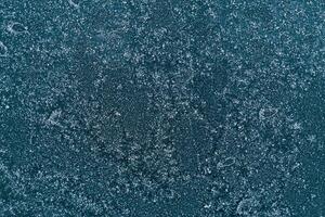 Frozen window. Abstract winter background - blue frozen window. photo