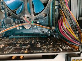 Dust in computer case. Big part of dirty dust on the computer pc processor cooler with mainboard. photo
