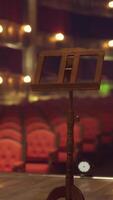An empty theatre with rows of red chairs video