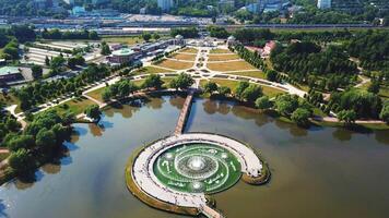 Bird's-eye view.Creative.A beautiful summer landscape from a height where you can see a monument, a summer forest, a bridge, beautiful summer trees with green petals and a road with ashins video