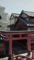 A building with a red gate in front of it video