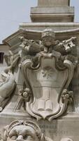 Bottom view of the fountain with sculptures in the city square. Action. Classic monument with a tall column. video