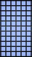 Abstract blue wall of same size squares with a vertical moving wave. Design. Cubic shaped background with a round light spot. video