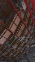 Top view of windows of glass skyscraper. Stock footage. Modern architecture of high-rise buildings with glass facades. Corner with view of glass facade of business skyscraper video