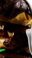 Baked cookies with chocolate icing. Stock clip.A green background on which fresh sweet cookies with chocolate are poured with custard. video