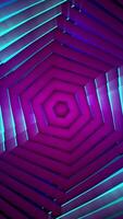Flight in tunnel of spinning spiral shaped figures with changing colors, seamless loop. Motion. Abstract rotating motion of hexagons creating an endless corridor. video
