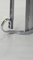 A detailed view of a fabric cutting machine being used with precision in a textile industry setting video