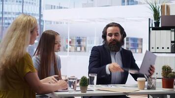 Financial advisor presenting detailed financial market analysis to clients, helping them make informed investment decisions. Broker providing customers with financial analysis, camera B video