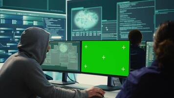 Governmental hackers working on computer with green screen to protect data and network security. Focusing on cyber defense, malware detection to prevent cyber attacks and espionage. Camera B. video