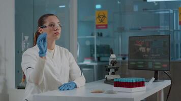 Lab worker using glasses with virtual reality to develop experiment, working with vr goggles to analyze 3d projection for futuristic development in laboratory. Digital presentation video
