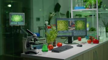 Empty microbiology laboratory with nobody in it prepared for genetic mutation analysis using hight tech tools. Interior of lab is equipped with microscope, test tubes ready for medical experiment video